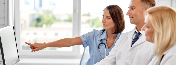 A patient signs a consent form in a medical facility, ensuring informed healthcare decisions.